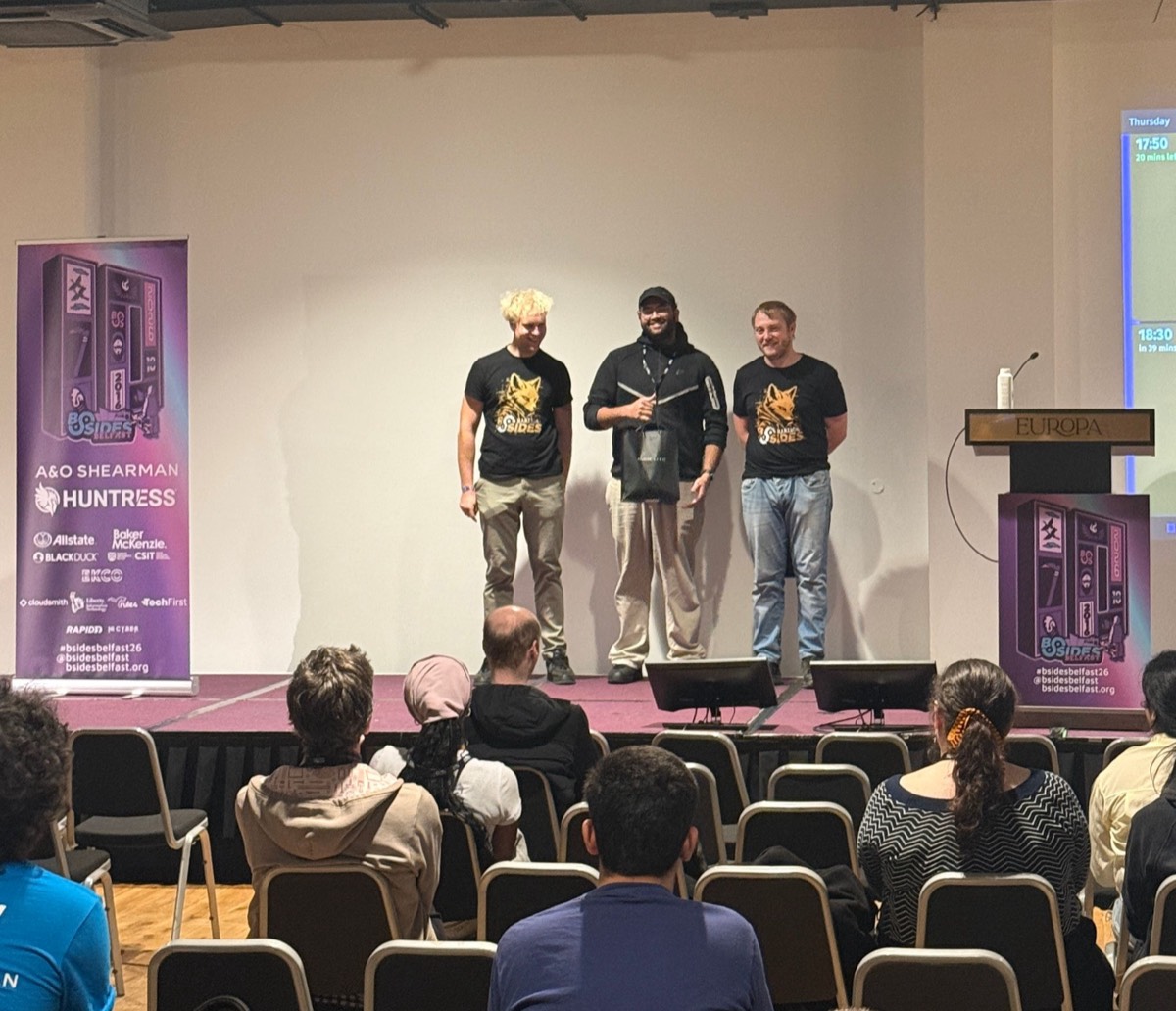 Murtuza on stage collecting second place at the BSides Belfast Hacker House CTF
